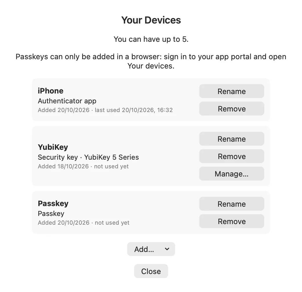 Your Devices window listing an authenticator app, a security key and a passkey, each with Rename and Remove buttons.